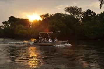 gather on the banks of the Chobe River. Or spot wildlife from the water, joining one of the acclaimed guides on a water safari on specially adapted motorboats.