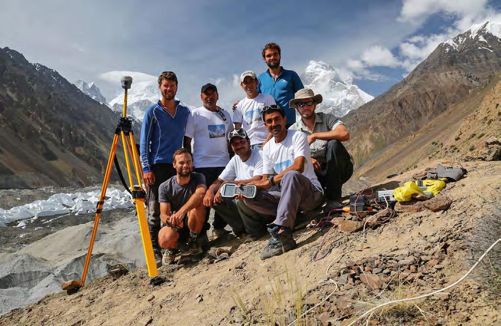 The expedition team at the GNSS reference station alongside Yukshin Glacier. Pakistani guides played an essential role in the project s success.