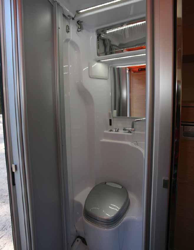 Bathroom door and floor pan extend outwards to provide more showering room.