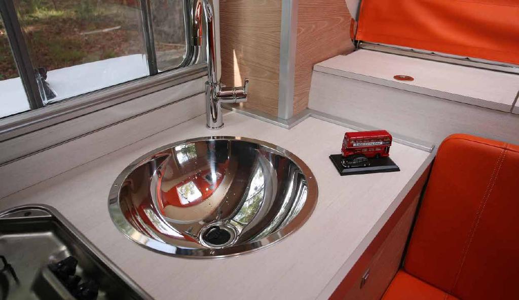 Round sink is stylish, London bus and car set is Malcolm s! the predominantly orange coloured upholstery and roof lining catch the eye and look pleasingly different.