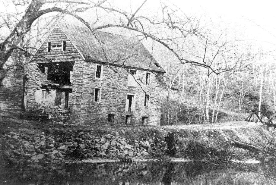 1890s photograph of the ruins of the Argyle fl our mill. Visible are Blagden Mill Road and the bridge over Rock Creek. Records of the Columbia Historical Society.