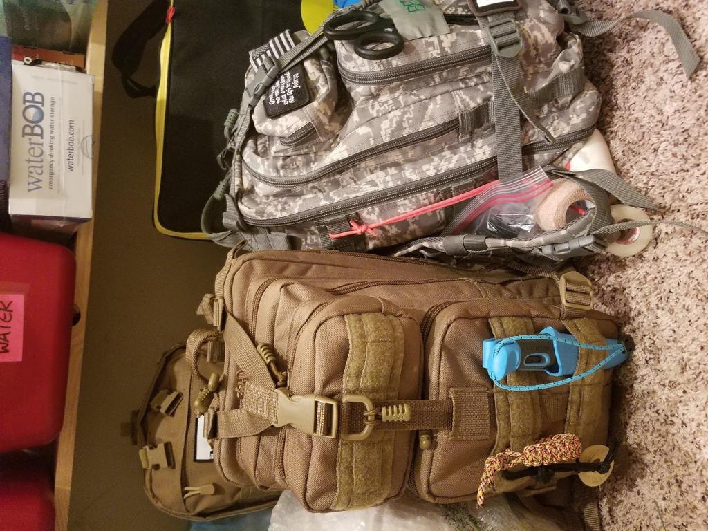 In this photo you can see two of our emergency kits (bug out bags) packed and ready to go.