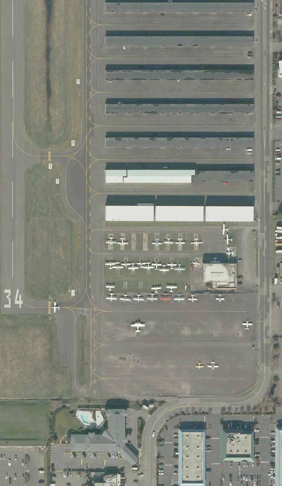 NE E STREET TAXILANE OFA (HANGARS) TAXILANE OFA (PARKED AC) TAXILANE OFA (PARKED VEHICLES) * RPZ (AIRPORT CONTROL) * TAXILANE/TAXIWAY OBJECT FREE AREA PARKED VEHICLES OBSERVED IN VARIOUS HANGAR ROWS.