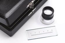 Large Scale Stage Micrometer A precision glass scale suitable for calibration and mea sure ment of large field stereo microscope images. Comes with 15x eyepiece and case.