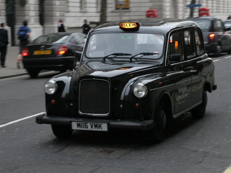 LONDON TAXI Austin FX4 London black cab, taxi carrying out functions.