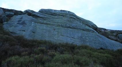 Moving South from Low Roof there are two large upturned boulders with slabby front faces the Grim Slabs.