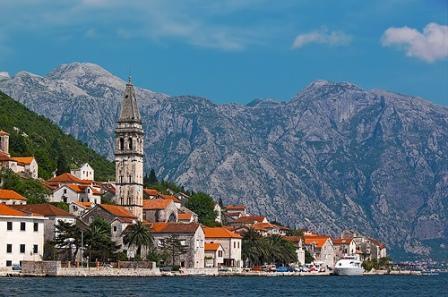 opposite the entrance to the inner Bay of Kotor. Hear the history of this fascinating town, which was home to wealthy seafaring families before becoming famous as an artists colony.