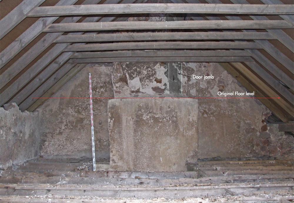 5.24.2. A single fireplace [171] of large sandstone blocks with surviving grate has been inserted into an earlier fireplace flue on the east.