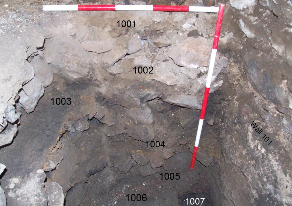 5.26. The Test pits (Figure 2) 5.26.1. Test pit 1 was located in the northeast corner of room 1 against the north wall [101]. The agreed size was 1.00 m 