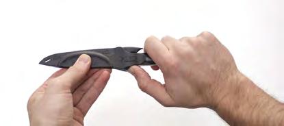 Figure 6 Figure 7 Removing Sheath From Knife Step 1: With one hand, firmly grasp the sheathed knife by the knife handle with the knife blade cutting edge facing away from you and with the opposite