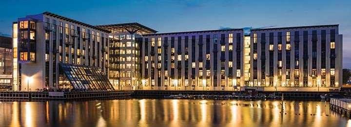 ACCOMMODATION OPTION COPENHAGEN ISLAND HOTEL Enjoy spectacular views across the harbor from this contemporary hotel complex of steel and light colors.
