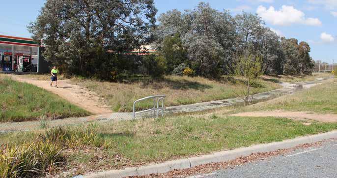 Figure 16: Informal pedestrian access to the centre from public transport facilities on Athllon Drive Access to the centre is difficult and unpleasant for both pedestrians and cyclists.