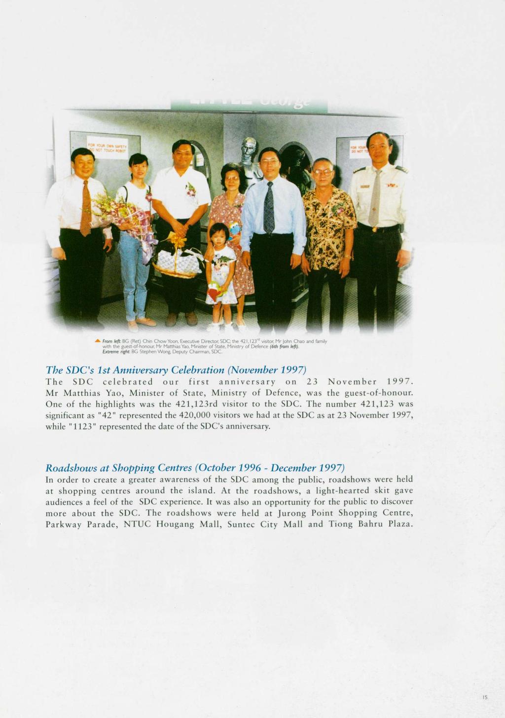 ^ From left BG (Ret) Chin Chow Yoon, Executive Director SDC; the 421,123 d visitor Mr John Chao and family with the guest-of-honour, Mr Matthias Yao, Minister of State, Ministry of Defence (6th from