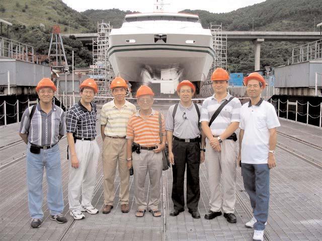 with a catamaran seating behind for its docking repair President ZHANG of Shanghai SNAME and Mr.
