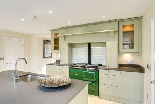 The made to measure kitchen incorporates integral fridge and freezer, dishwasher, double oven and gas fired Aga, refurbished by Blake and Bull.