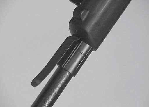 2. Install the tool over the stop in the handle guides as shown, one on each side.