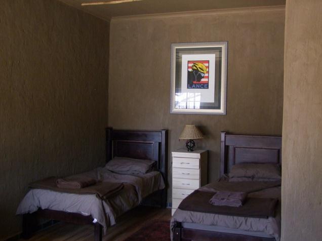 Facilities are as follows: Four African contemporary farm style rooms (approximately 40/50m²) with a maximum of four single beds per room sharing en suite showers and toilets.