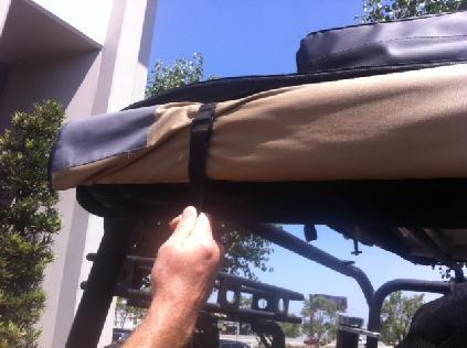 Step 2: Hold the awning and release the two straps (Fig H) (Fig G)