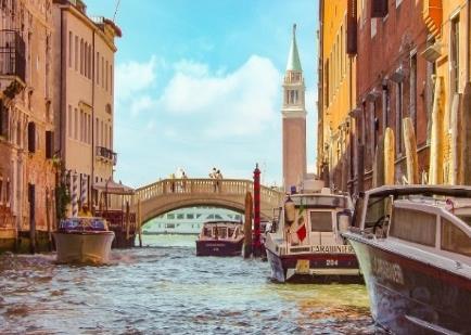 Take a walk along picturesque bridges and a gondola ride or just sip a Bellini cocktail at St. Marks square.