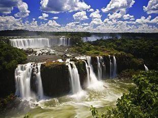 Day 1 ARRIVAL AT IGUAZÚ FALLS While approaching Iguazú International Airport, catch sight of the magnificent Iguazú Falls and the surrounding natural park of Argentina, Brazil, and Paraguay.