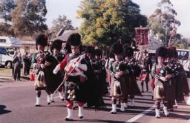 The day encompasses pipe band displays, tartan warriors