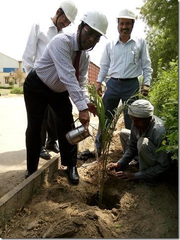 He inspected the facility and planted a tree