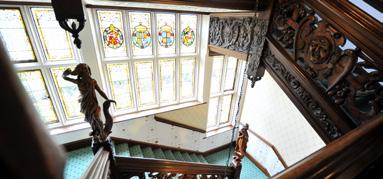The building incorporates stained glass windows, a large imposing ornate hand carved staircase, wood panelling in principal