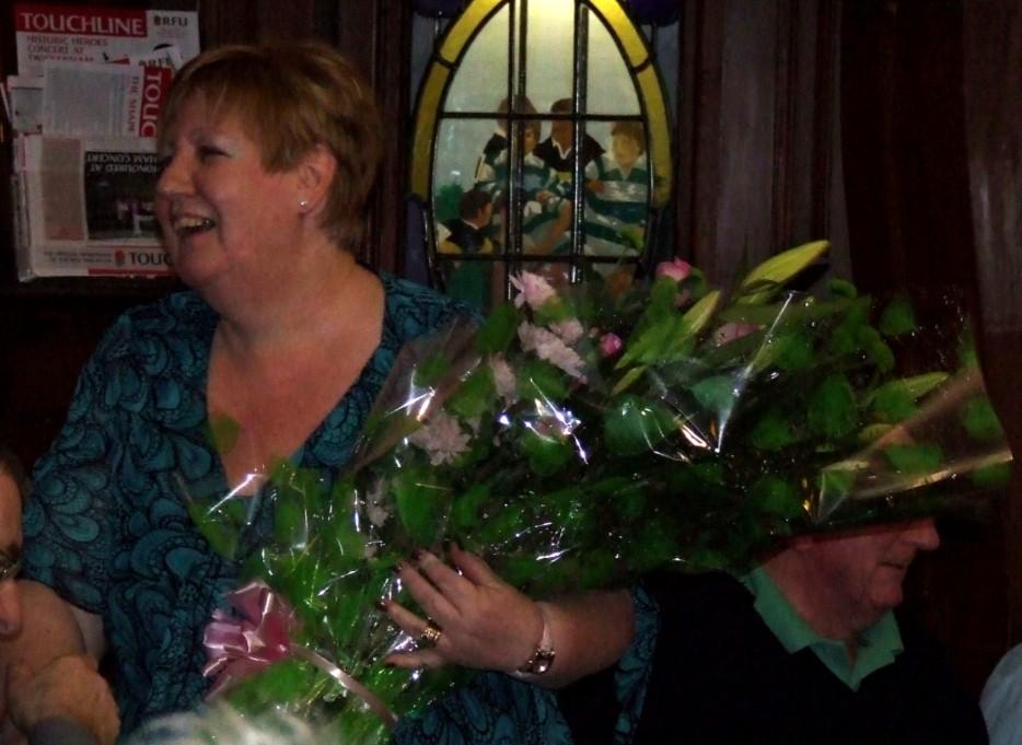 Val with the flowers presented by Mick Cook.