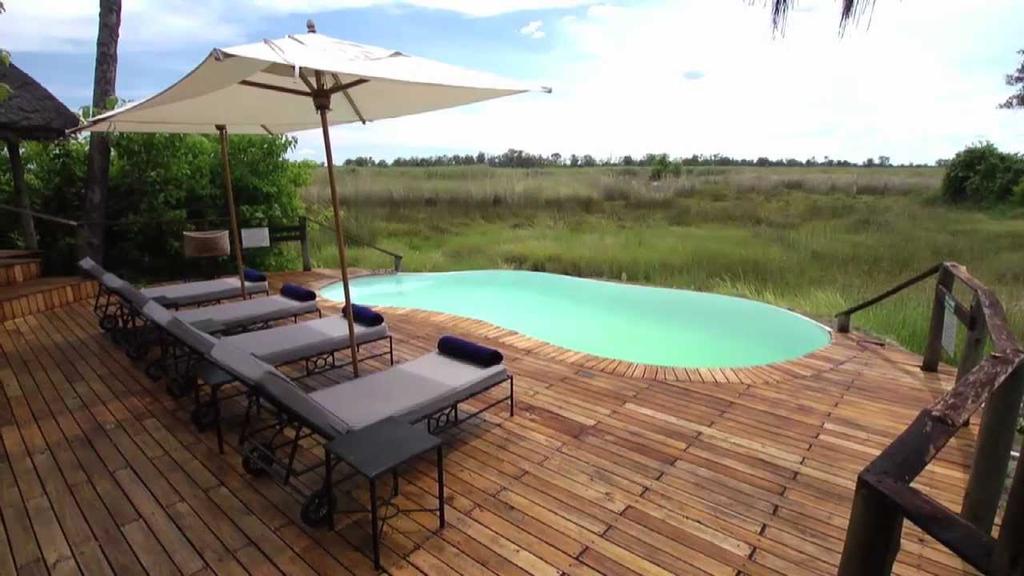 papyrus beds, Sanctuary Baines Camp is located in a private concession bordering the Moremi Game Reserve.