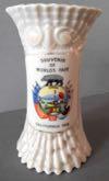 Estimate: $ 25-0 Lot # 120 - China Talcum Powder Shaker with "Souvenir of Worlds Fair" above the "Eureka" state logo with the bear on top, beautiful landscape in the middle and the American Flags on