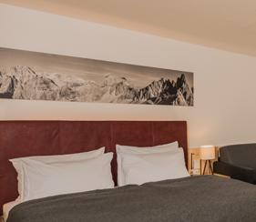 25-27 m² DOLOMITENHOF COMFORT 2-3 PERSONS New, cosy room with a comfortable sitting area, panoramic windows, balcony