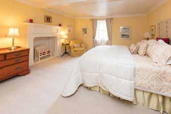 doors. The large kitchen benefits from an Aga range stove. Gas central heating is provided throughout the property.