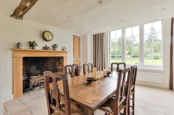 Reception room with dual aspect THE ACCOMMODATION The ground floor accommodation offers an entrance hall, four reception rooms, an exceptional kitchen by Bulthaup with