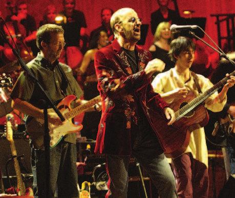 Pictured: Eric Clapton (left) and Ringo Starr (center) perform at the 2002 Concert for George.