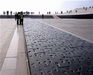 This display consisted of a 100 yard long bronze pathway with the footprints of 10,000 Dalian citizens deeply imprinted into the bronze.