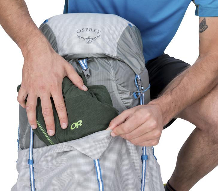 access when wearing the pack. Items can be inserted from the top or side.