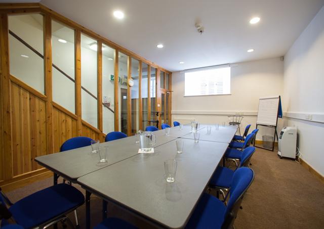 a large central meeting table and can comfortably seat up to