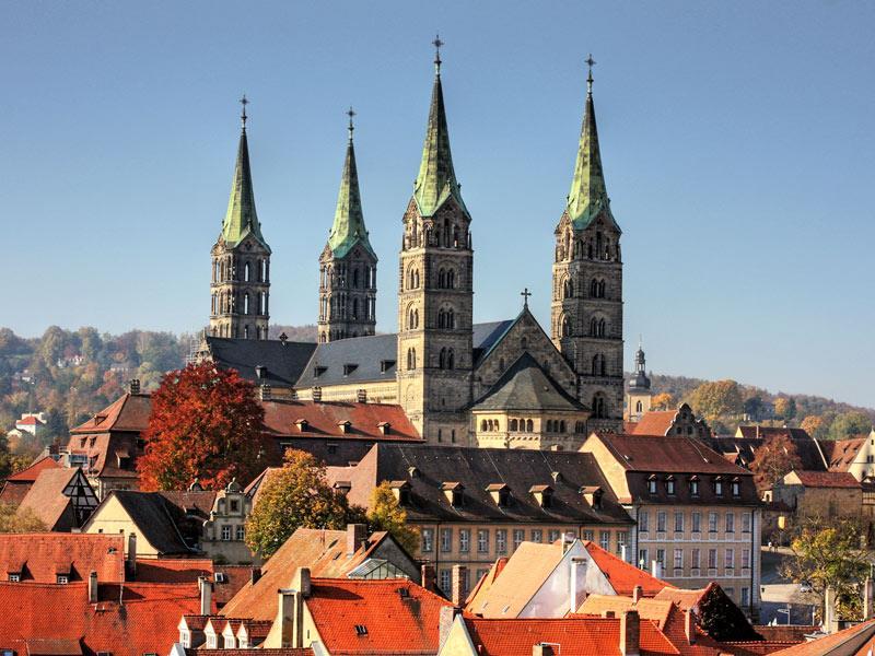 cathedral, Old Town Hall, and seven hills crowned with churches.