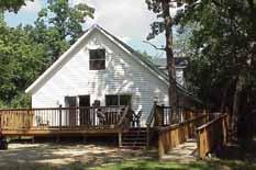 Three bedrooms, one bath, covered porch and wood burning fireplace. Not air conditioned. Cap. 8 (8 singles); $160 per night.
