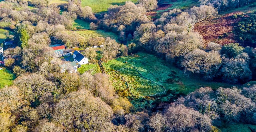 Traditional & modern outbuildings Idyllic valley position Adjoining the River Tâf Pastureland & woodland In all, about 171 acres (stms) Situation Pant Y Gelli farm occupies an idyllic location about