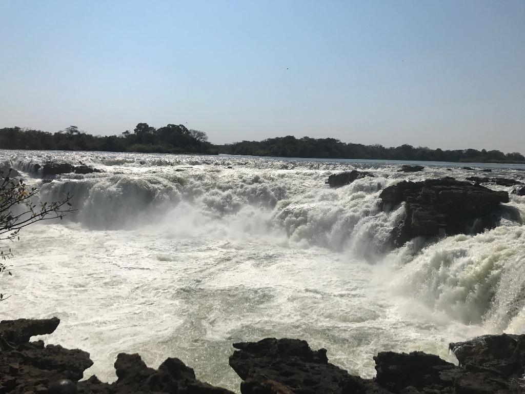 ZAMBIA Ngonye Falls DESCRIPTION Ngonye Falls are waterfalls on the Zambezi river, located approximately circa 350 km north of the Victoria Falls.
