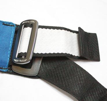 Confirm that the webbing fold back end is under (below) the large buckle s outside edge.
