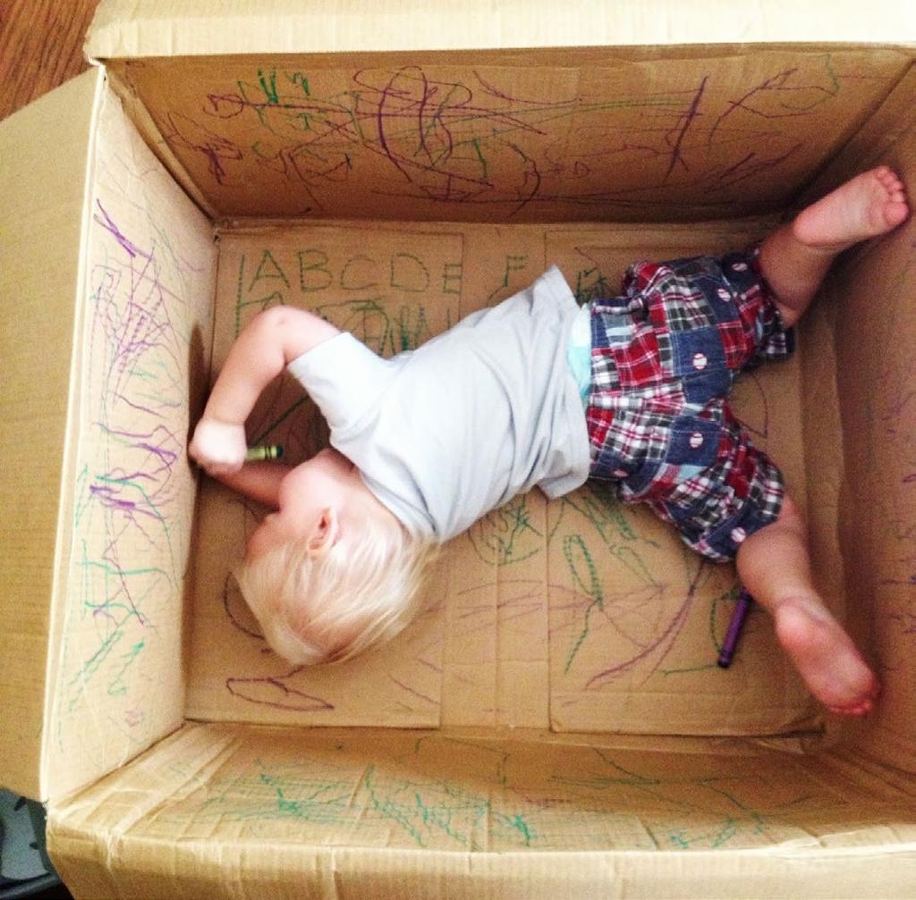 Give your kiddo a giant cardboard box with a bunch of markers for