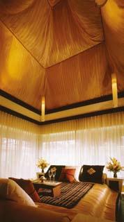 Slip into a king-sized bed draped in pure Thai silk at the Spa Pool Villa.