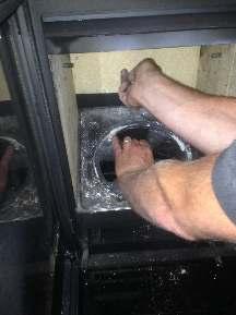 to vertical position turn and remove from combustion chamber. Remove base grate.