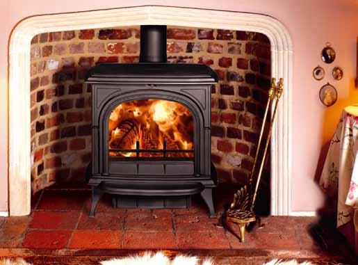 Matt Black multi-fuel Huntingdon 40 with clear door and optional short legs burning logs. Huntingdon 40 The biggest model in the Huntingdon range and the most powerful.