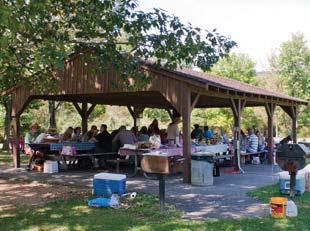 11 GATHERING SPACE Provide a new picnic shelter and restrooms for large groups (over 100 people), new playground, and