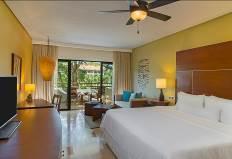 This oversized guest suite overlooks the lush tropical gardens that surround the resort and is elegantly decorated in the tones of the tropics and features stylish marble floors accentuating classic