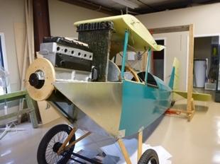 Project Two is Richard Zeiler s Travel Air D-4D. This beauty sports a spectacular paint job laid out and painted by Flabob fabric and paint artisan Nando Mendoza.