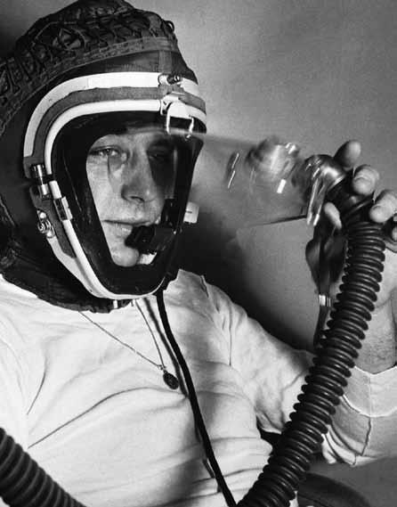 2 Lockheed pilot Bob Schumacher dons the improved MC-2 helmet for prebreathing; it would be covered